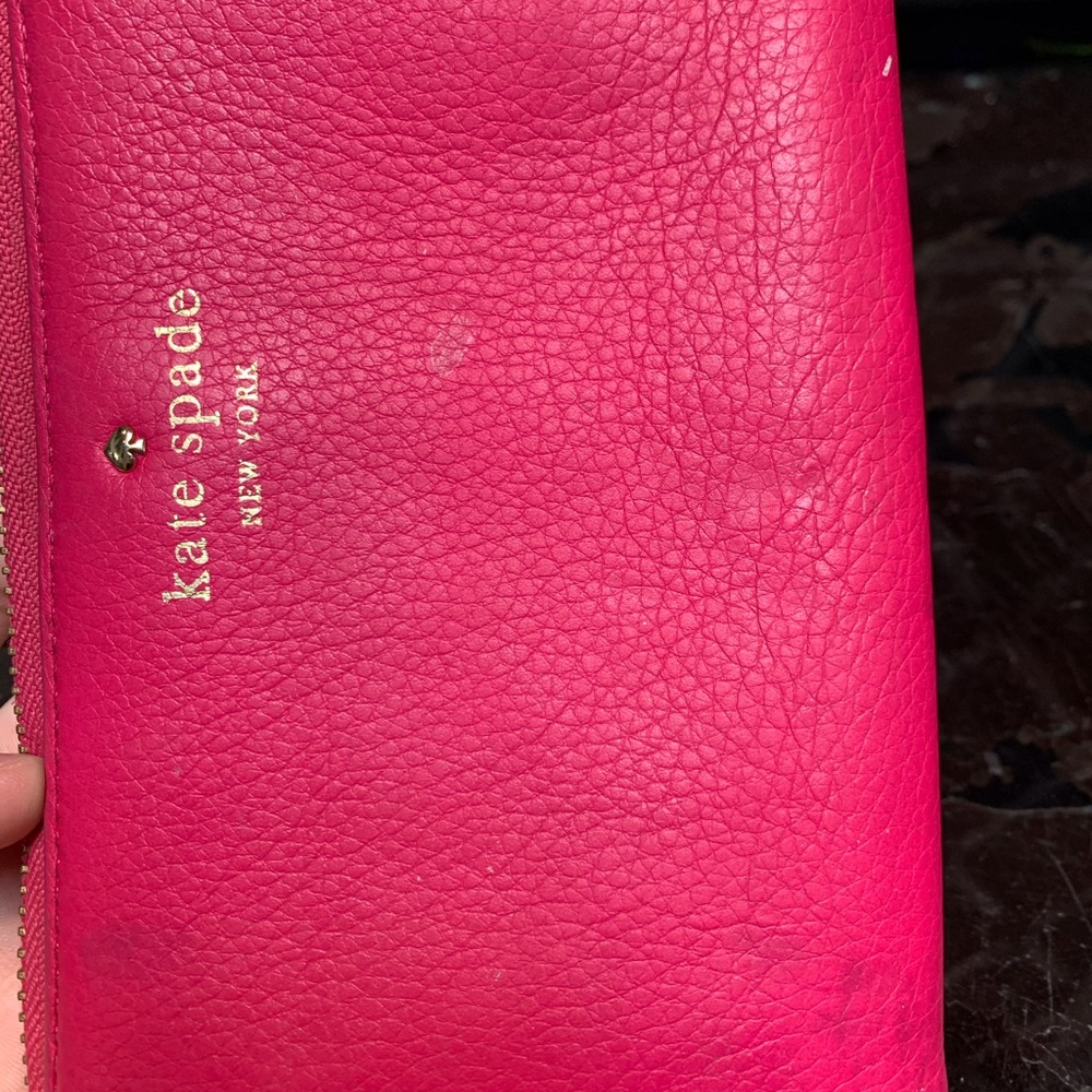 Fuchsia wallet with many spots